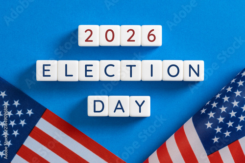 2026 election day text on blocks with american flags on blue background