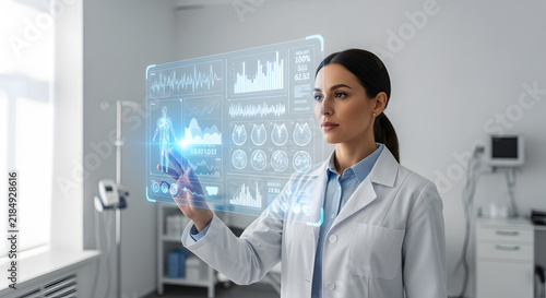 Female doctor using advanced medical interface with data and charts in hospital environment.