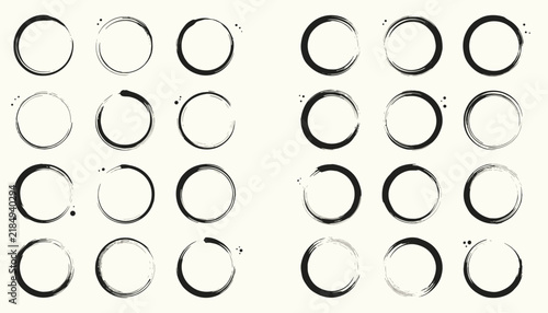 Large collection of hand drawn black watercolor ink splash rings and circular frames on cream background.
