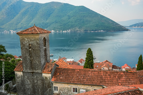 Stone tower and red rooftops above the Bay of Kotor, Perast