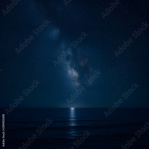 Night sky with stars and ocean reflection in peaceful atmosphere  