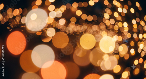 Warm Golden Bokeh Light Background with Glowing Defocused Circles Festive Abstract Illumination Wallpaper