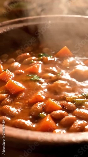 Steaming Hot Traditional African Food Bean and Vegetable Stew Served in a Rustic Clay Pot
