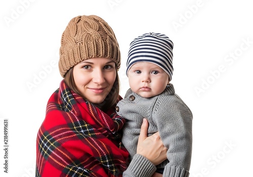 Smiling woman holding baby outdoors