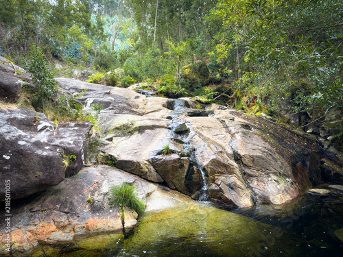 Scenic natural waterfall and river pool at Rio Ancora