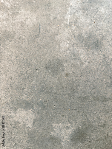 Grey concrete wall background with weathered texture
