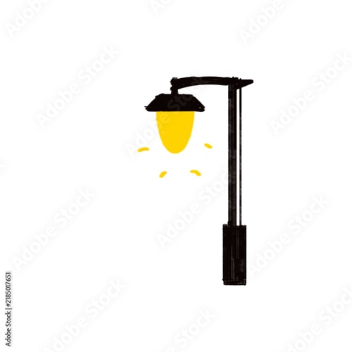 A glowing black street lamp with a bright yellow bulb against.