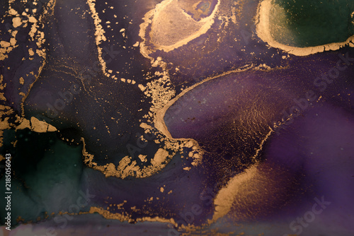 Abstract background of purple-green and gold stains. General plan photo.