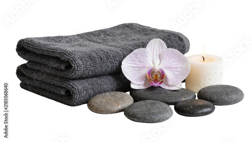 Cuadro en lienzo Stack of grey towels with orchid flower hot stones, and candle isolated on trans