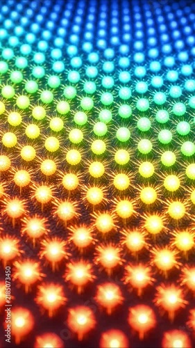 Colorful rainbow led lights glowing in a mesmerizing abstract geometric pattern with a pulsating wave effect on a grid panel