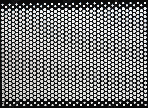 Obraz na plátně Black metal panel perforated with grid of small round white holes or dots
