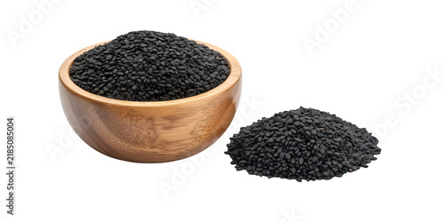 Bowl of black sesame seeds displayed with a small pile on a wooden surface isolated on transparent background