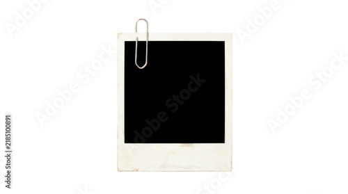 Foto Old vintage instant photo frame with a silver metal paper clip isolated on trans