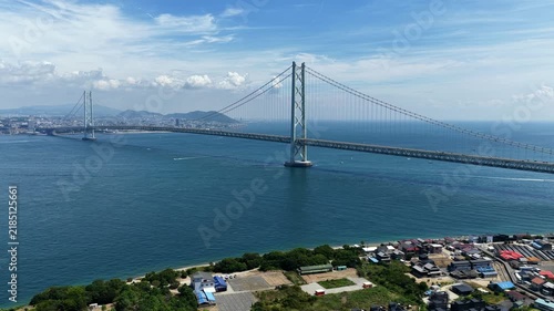 Aerial drone footage of Akashi Kaikyo Bridge over the strait in Awaji, Hyogo, Japan