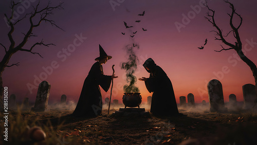 Two silhouette witches casting spell over bubbling cauldron in graveyard at sunset sky, created with generative ai.