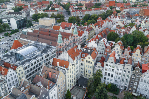 Aerial view of the historic city center with its characteristic red-tiled rooftops, narrow streets, and dense urban architecture in Gdansk, Pomeranian Voivodeship, Poland.