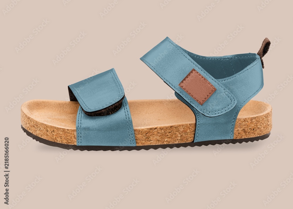 Obraz premium Blue cork footbed sandal isolated on beige background