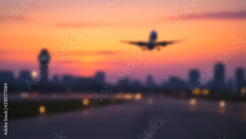 Blurry silhouette of an airliner for international tourism, vacations, and travel themes