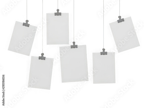 Blank paper notes hanging on strings with metal clips isolated on transparent background