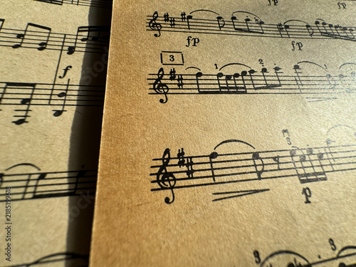Obraz na plátně Close up of old sheet music with musical notes and clefs