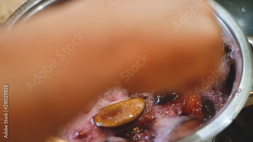 Plums Boiling in Pot Cooking Homemade Plum Jam Close Up