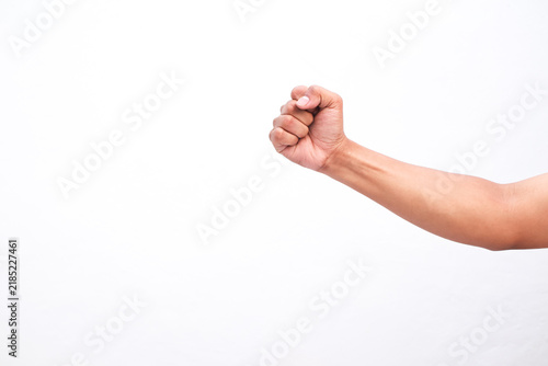 Close Up Of Human Hand Clenched In A Fist Isolated Against A Clean Solid White Background