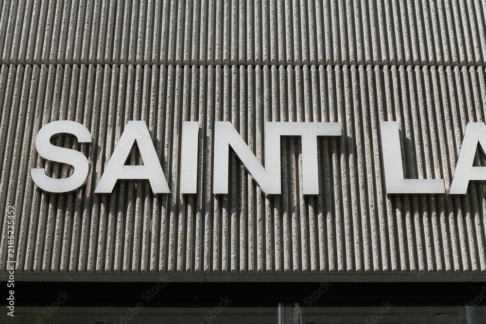 Fototapeta premium exterior building facade and sign of Saint Laurent, a high end designer clothing store, located here at 110 Bloor St W, Toronto