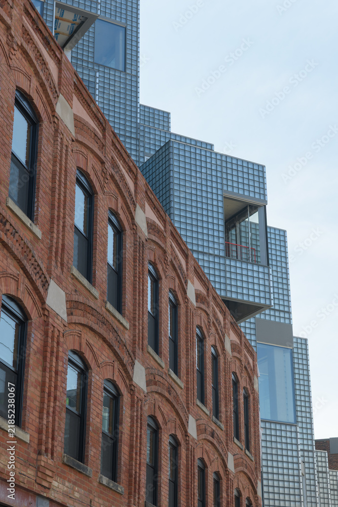 Obraz premium historic structure contrasted with exterior of KING Toronto Condos designed by Bjarke Ingels Group (BIG) in the area of King W and Portland