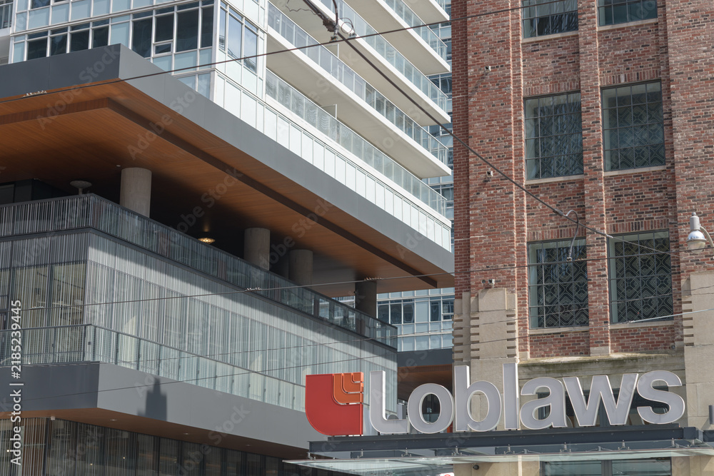Obraz premium corner with sign of Loblaw Grocerteria former headquarters and warehouse now the West Block development located at 500 Lake Shore Blvd W, northeast corner of Bathurst St, Toronto