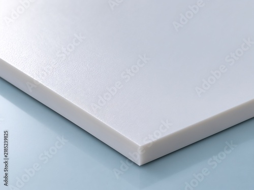 The white surface of the PVC sheet — close‑up shot.