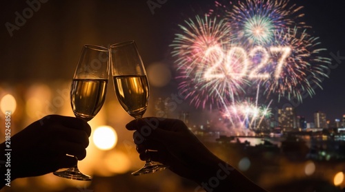 New Year 2027 celebration with champagne toast, festive fireworks over city skyline, holiday party atmosphere
