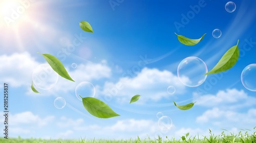 Green leaves floating in bright blue sky with soap bubbles and sunlight lens flare effect