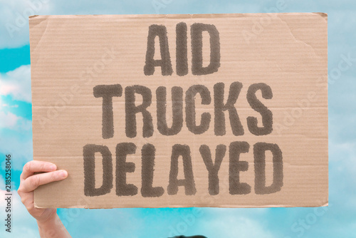 фотографія "Aid trucks delayed" Supply deliveries face obstruction