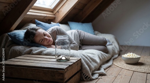 Resting beside a savings jar after a frugal winter day