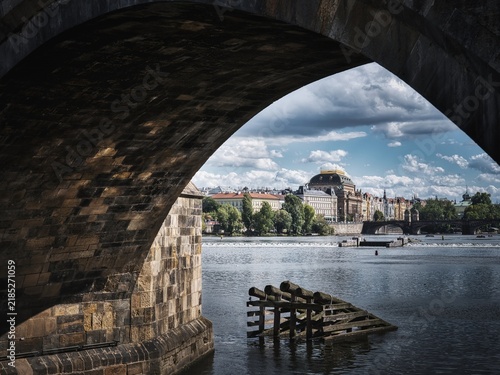 National Theatre and Vltava River framed by Charles Bridge in Prague