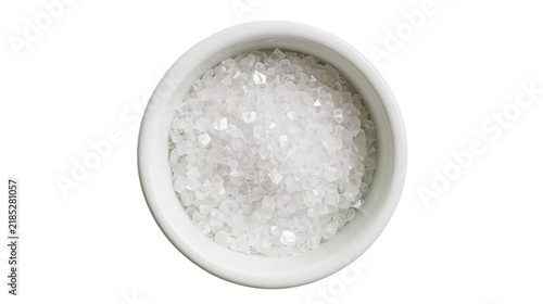 Fotografía Isolated small ceramic bowl filled with sparkling white sugar crystals, overhead