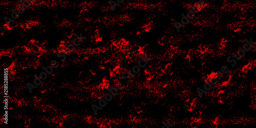 Abstract red light particles and glowing dust bokeh effects floating on a deep black background