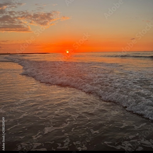 sunset on the beach
Beautiful nature photo, sea view over the Northern sea, foaming waves, bright sunlight. 
