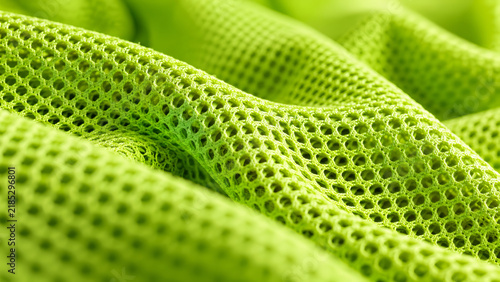 Green breathable polyester mesh fabric with a honeycomb pattern texture.