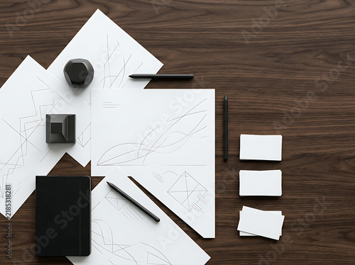 Modern Creative Workspace Mockup Featuring Professional Design Sketches and Stationery Supplies on a Dark Wooden Office Table Surface