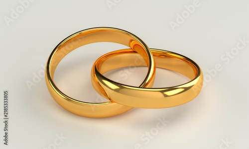 Cuadro en lienzo Two golden wedding rings linked together as a symbol of marriage love and relati