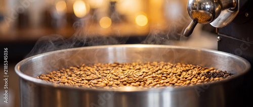 Freshly Roasted Coffee Beans with Rising Steam in Professional Roaster Cooling Tray, Cinematic Warm Lighting and Bokeh Background