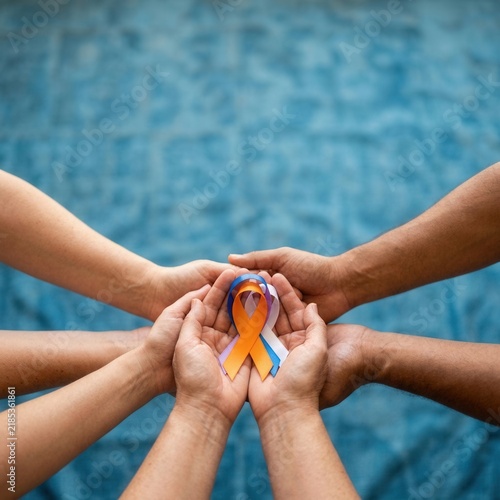 Hands Unite Holding Awareness Ribbon Symbolizing Hope And Solidarity