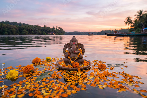 Ganesha Floating with Marigolds — Dusk Reflection
