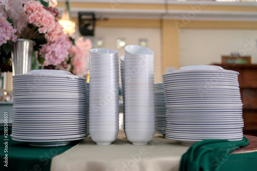 Stacked Plates and Bowls Arranged for Wedding Catering