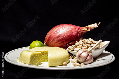 Garbanzo cheese on black background