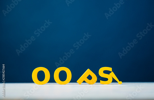 Bild auf Leinwand Oops mistake, error and unexpected problem concept with fallen yellow letters