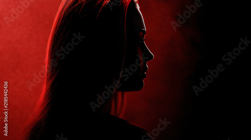 Woman in Profile Against Red Background