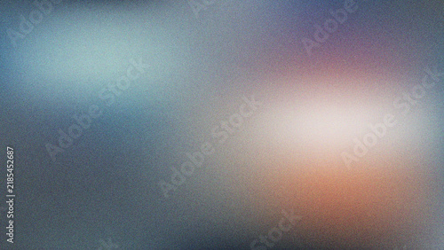 Abstract blurry background featuring soft gradient colors and textured film grain effect perfect for modern designs
