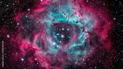 The Rosette Nebula, a stunning celestial formation composed of gas and dust, shines with vibrant pink and turquoise hues amidst a backdrop of distant stars